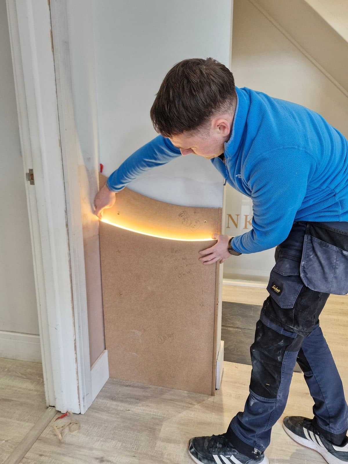 Fitting the backlit curve of the signature feature wall