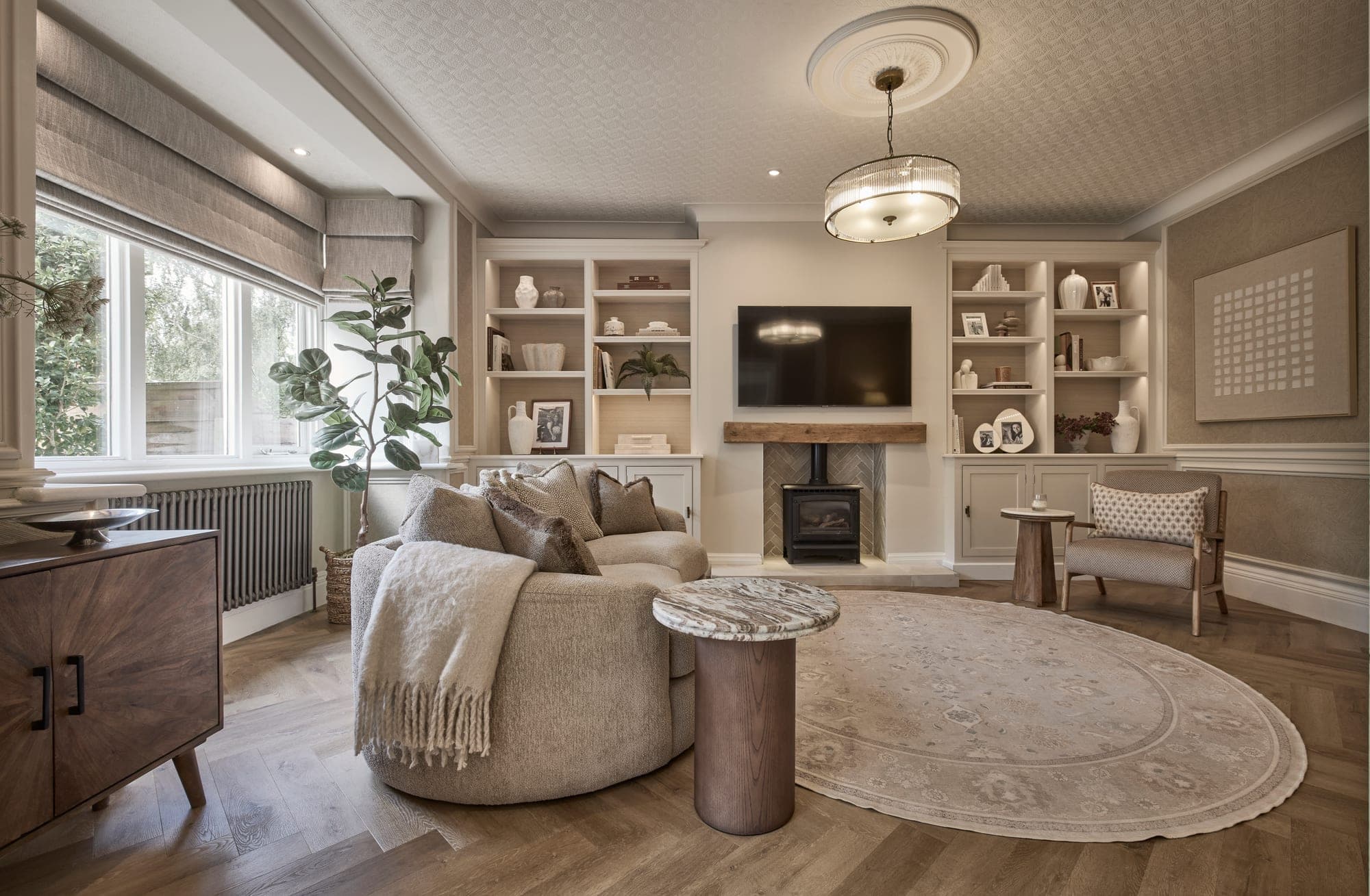 The finished living room in Hale, looking back towards the log burner and the bespoke alcove shelving