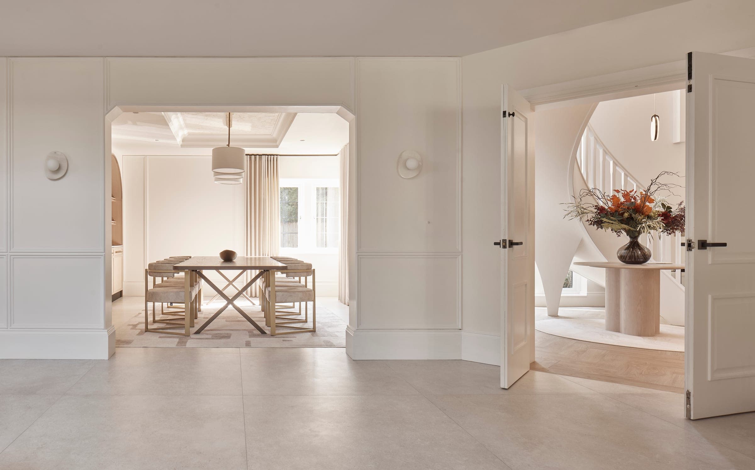 The dining room and entrance hall of a Prestbury home designed by Cheshire Property Studio