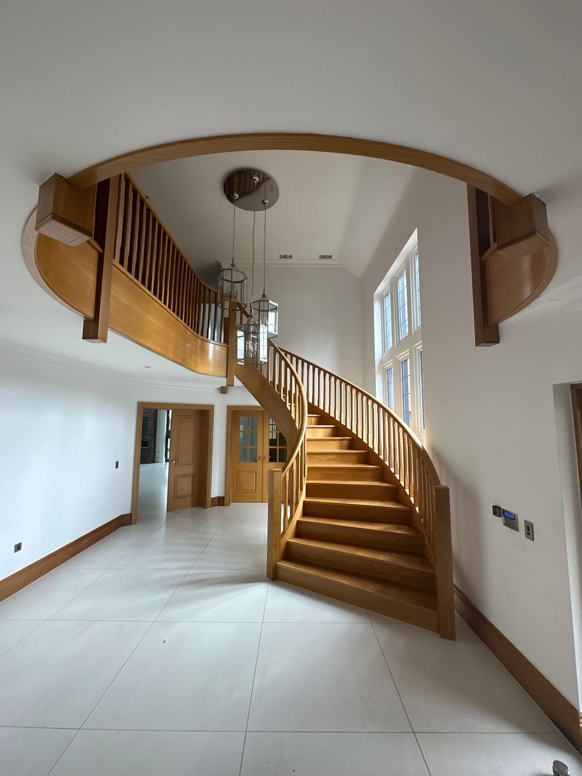 The entrance hall and staircase stripped back before the renovation
