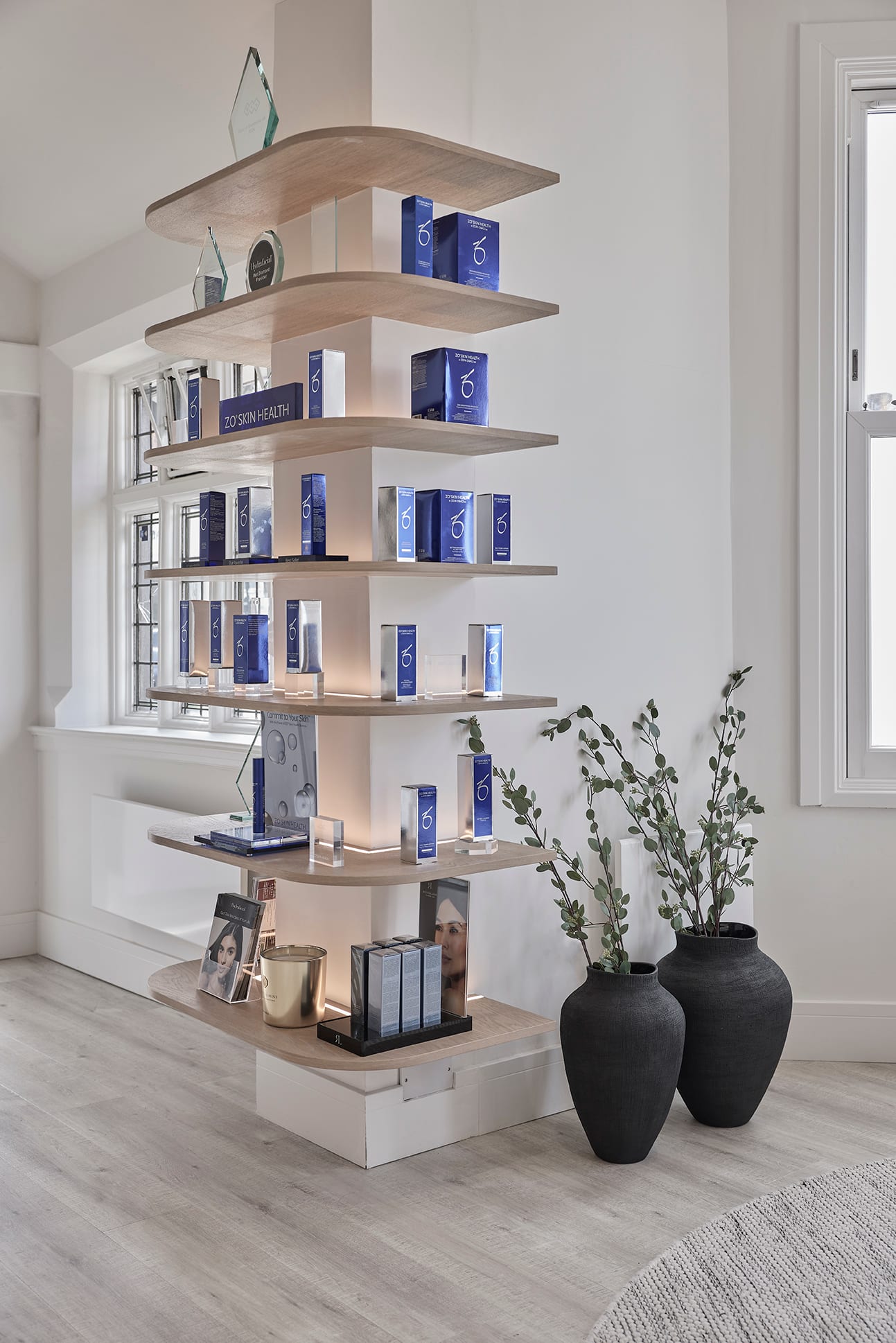 Bespoke floating shelves displaying products at Bank Medi Spa